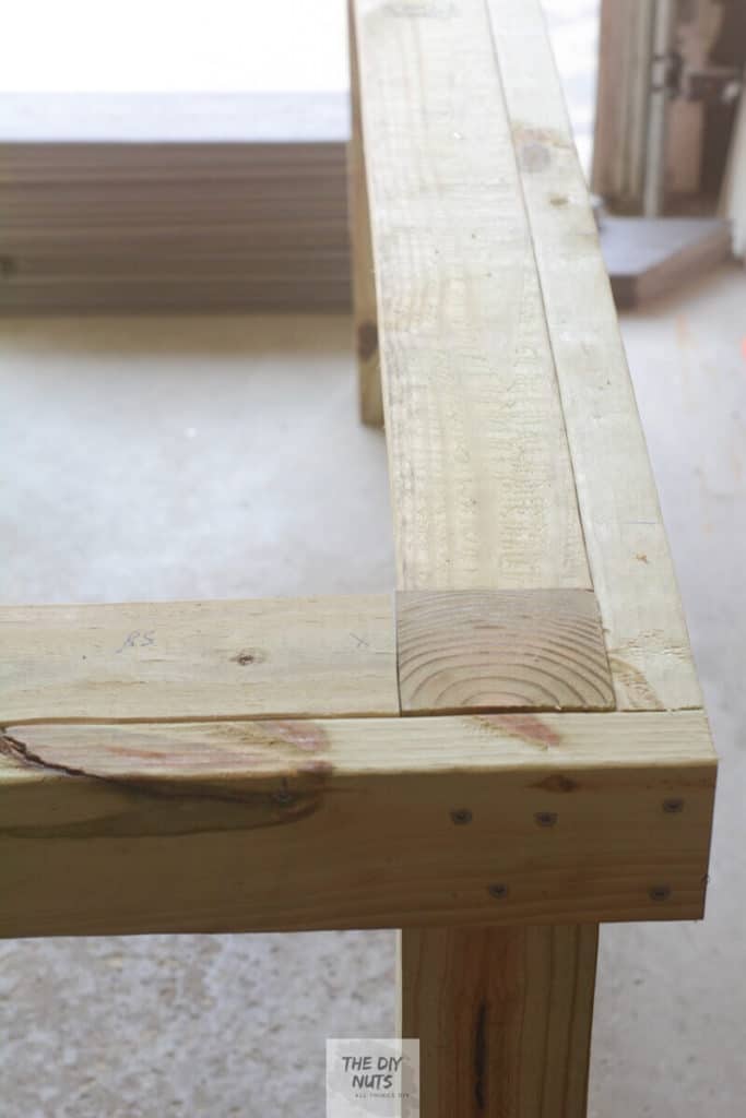 Add an extra 2' x 4' to the inside edge of outdoor table frame