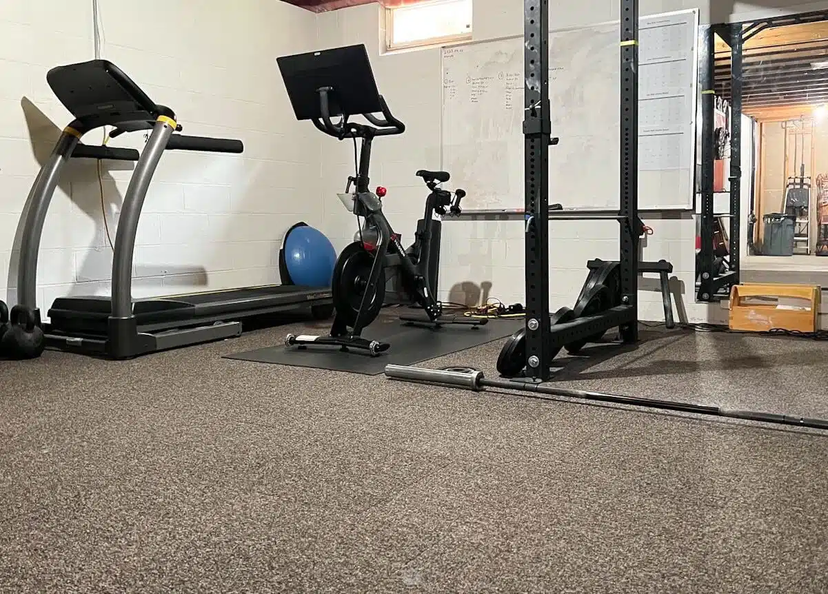 basement home gym with carpet squares.