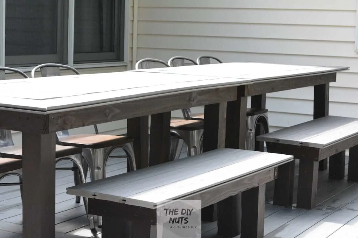 Gray DIY outdoor dining table and benches made with leftover composite decking