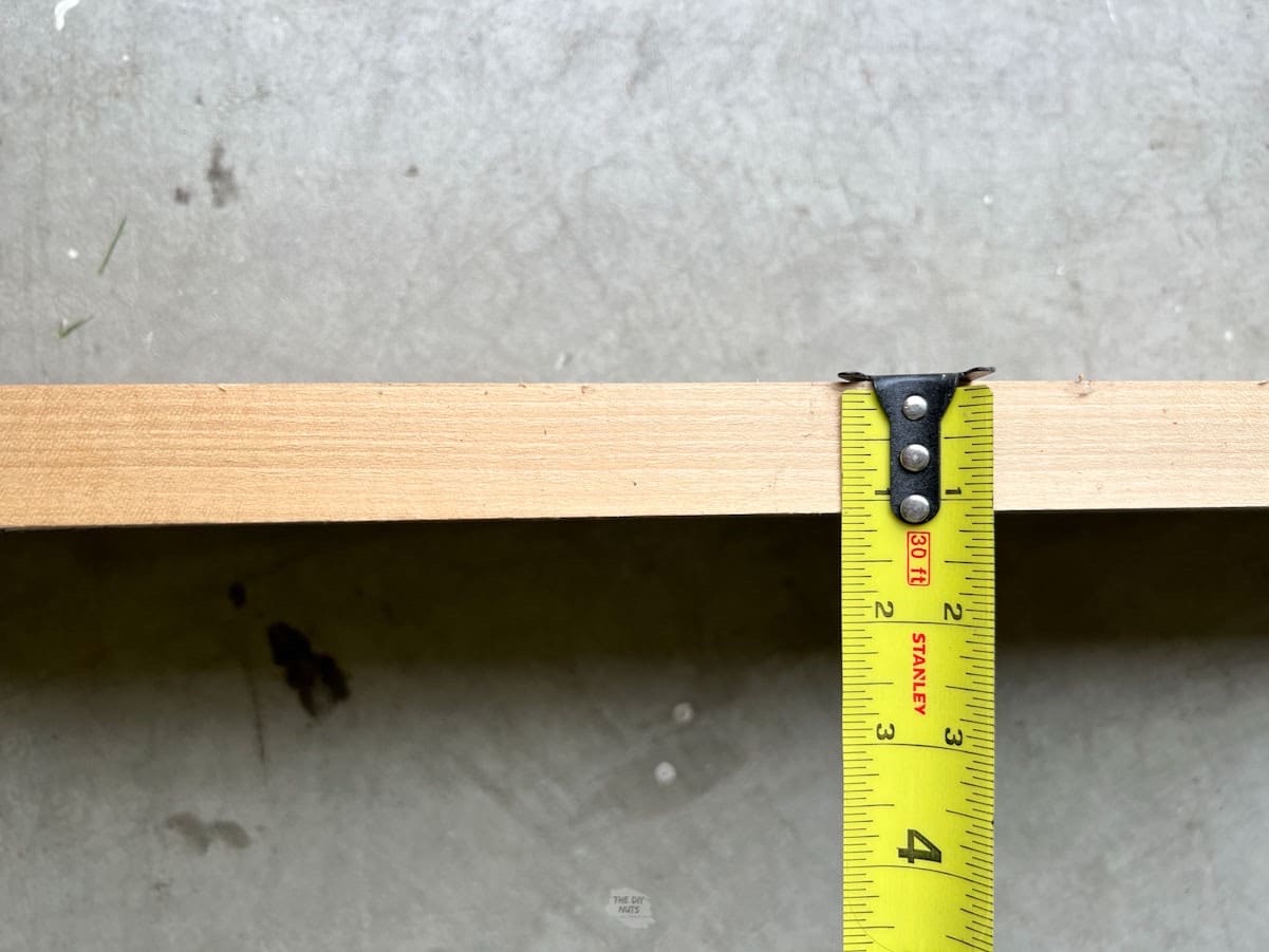 tape measure on thick piece of poplar wood.
