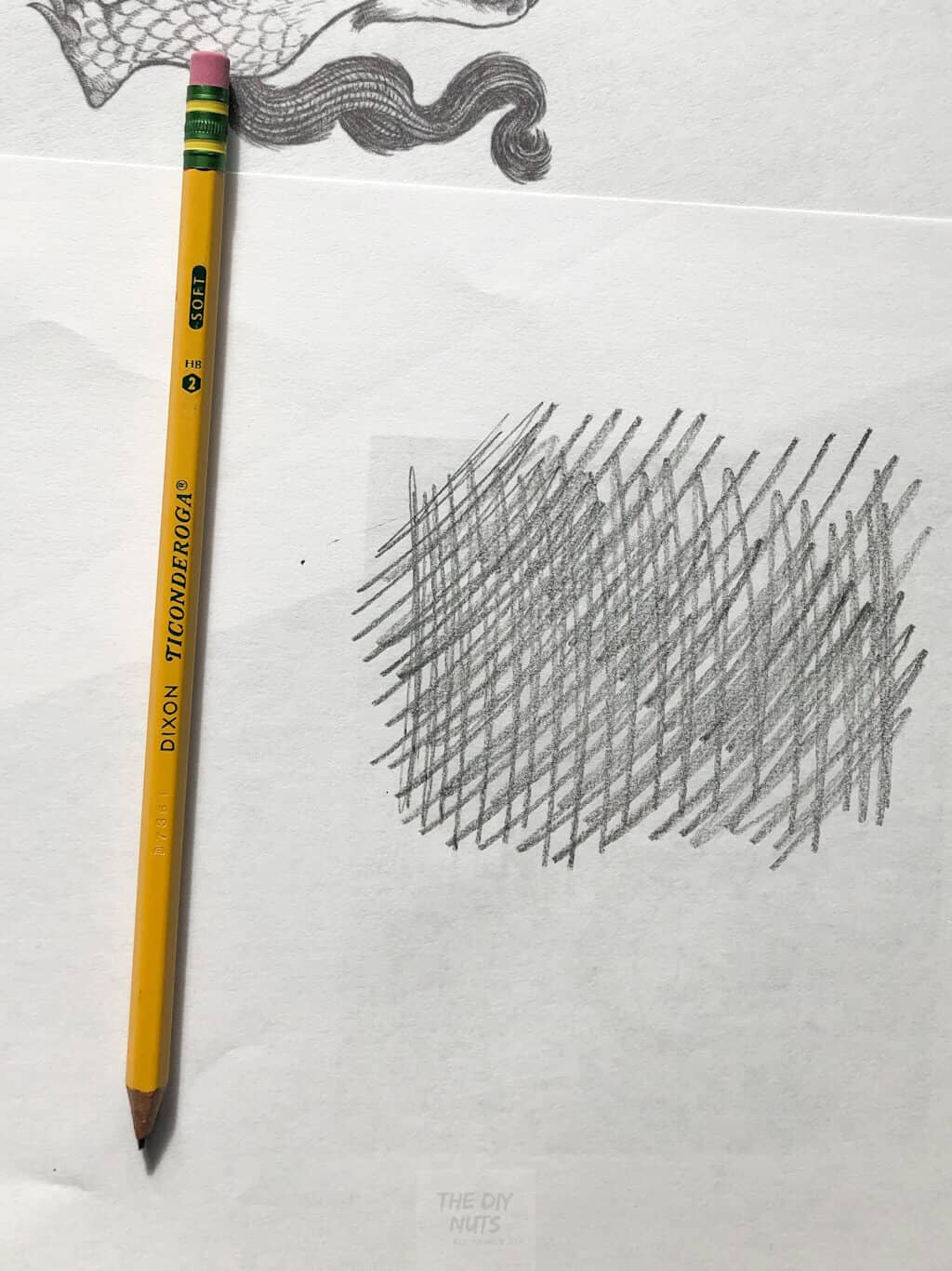 Putting pencil on the back of drawing
