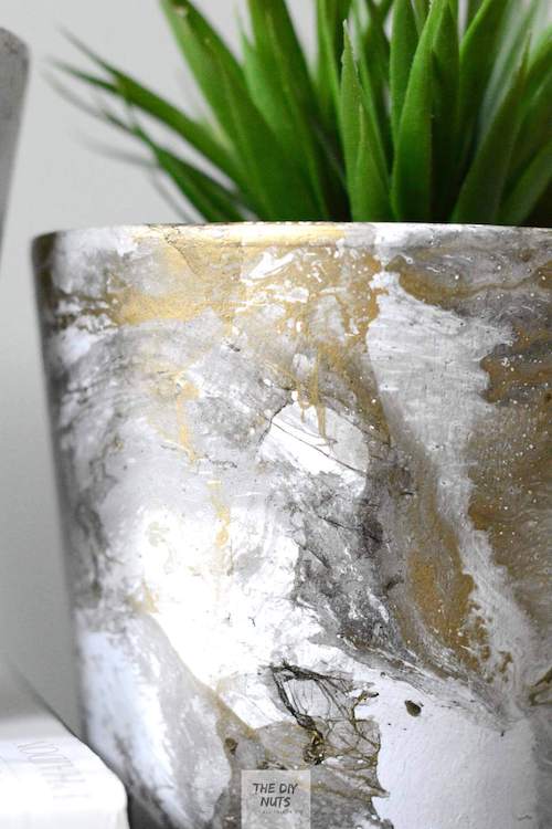 gold, gray and black painted flower pot