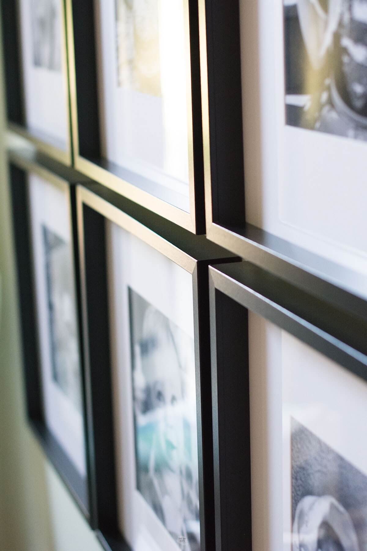 close up view of 6 black square frames with black and white photos.