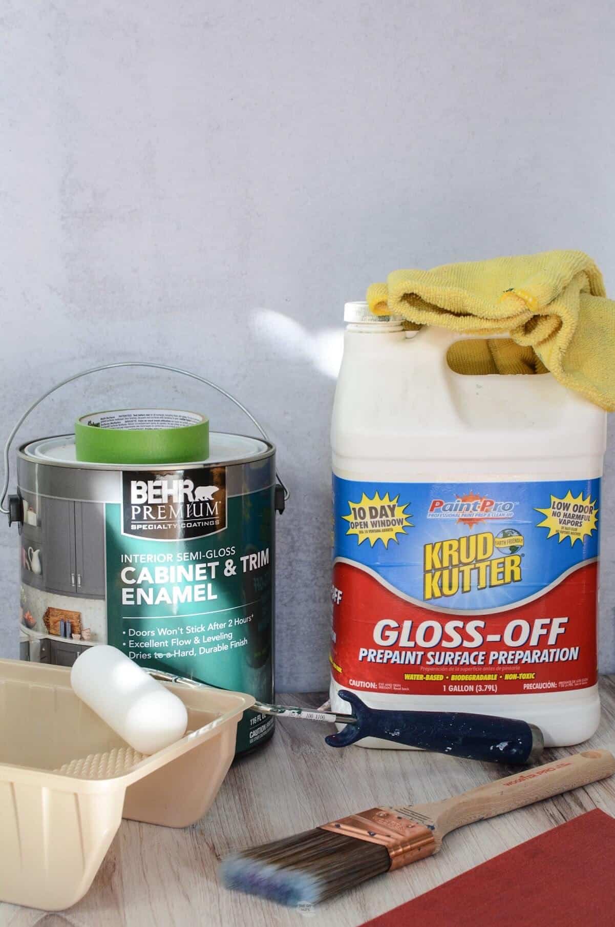 Deglosser, cabinet paint, paint tray, small roam roller, paintbrush and sandpaper.