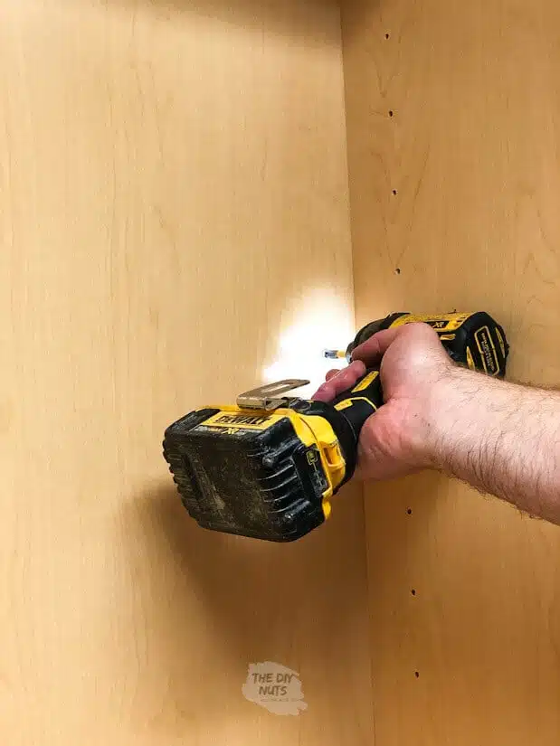 Attaching laundry room cabinets with drill