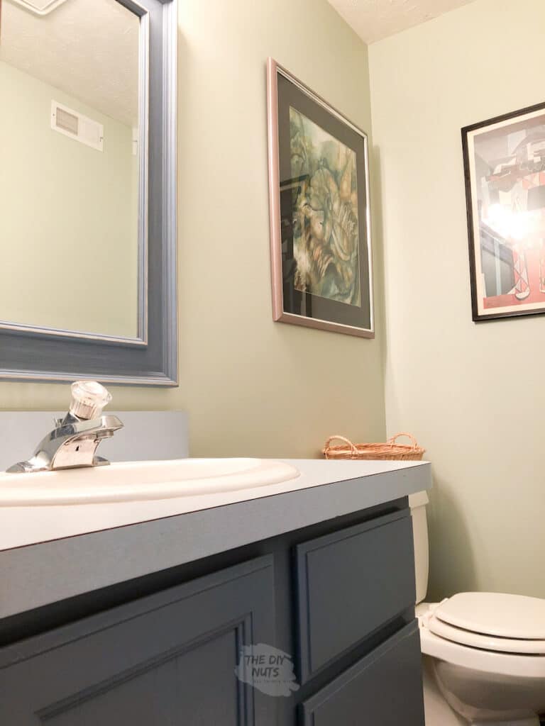 SW 6176 in small basment bathroom with painted oak cabinets