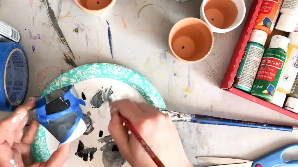 painter's tape used to create ombre geometric painted pot