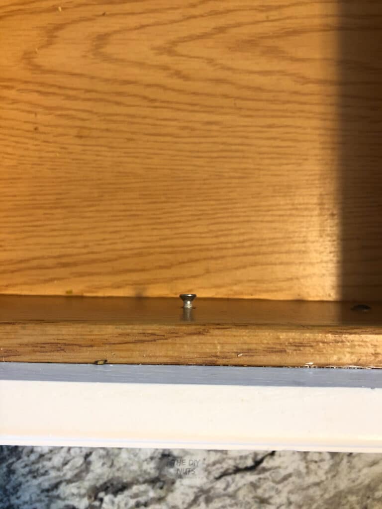 hardware screw inside kitchen cabinet drawer