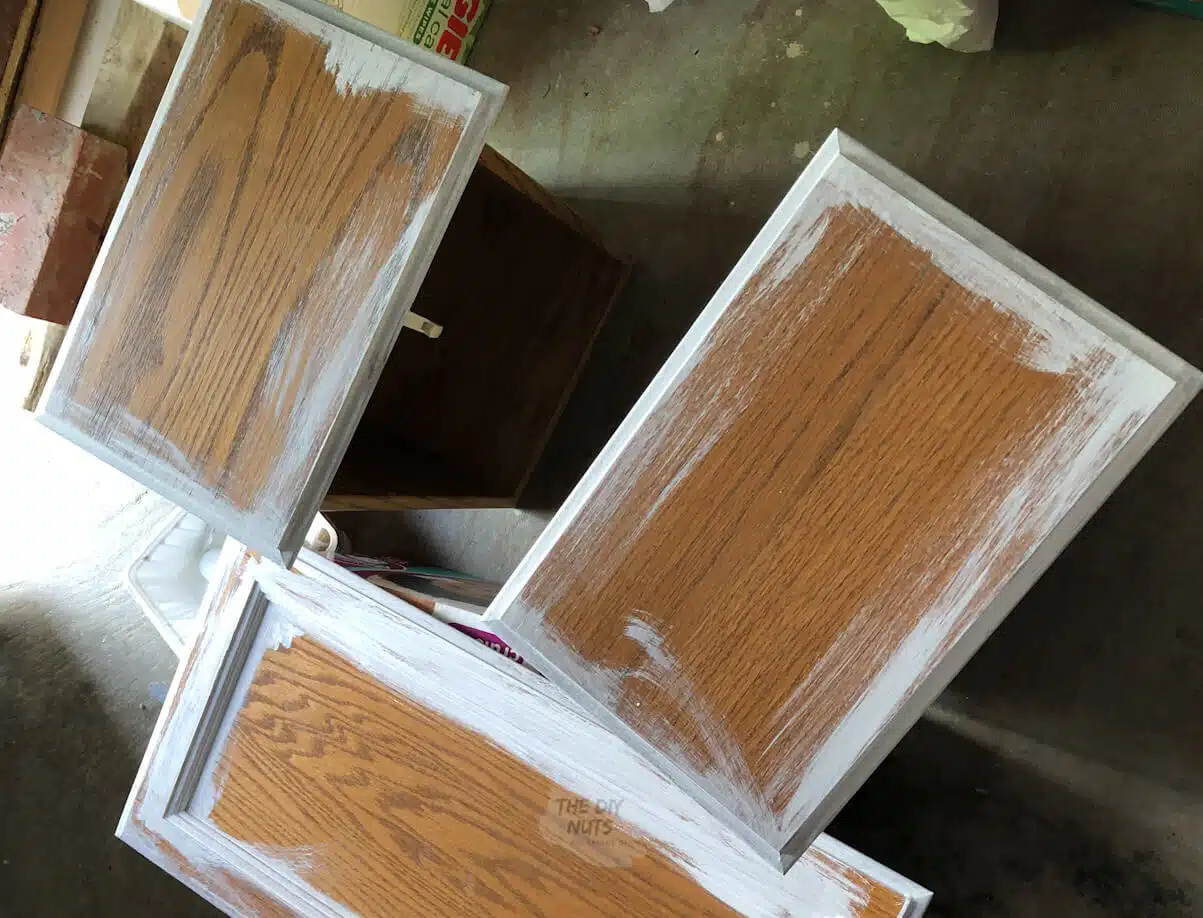 oak cabinet doors & drawers being primed before painting.