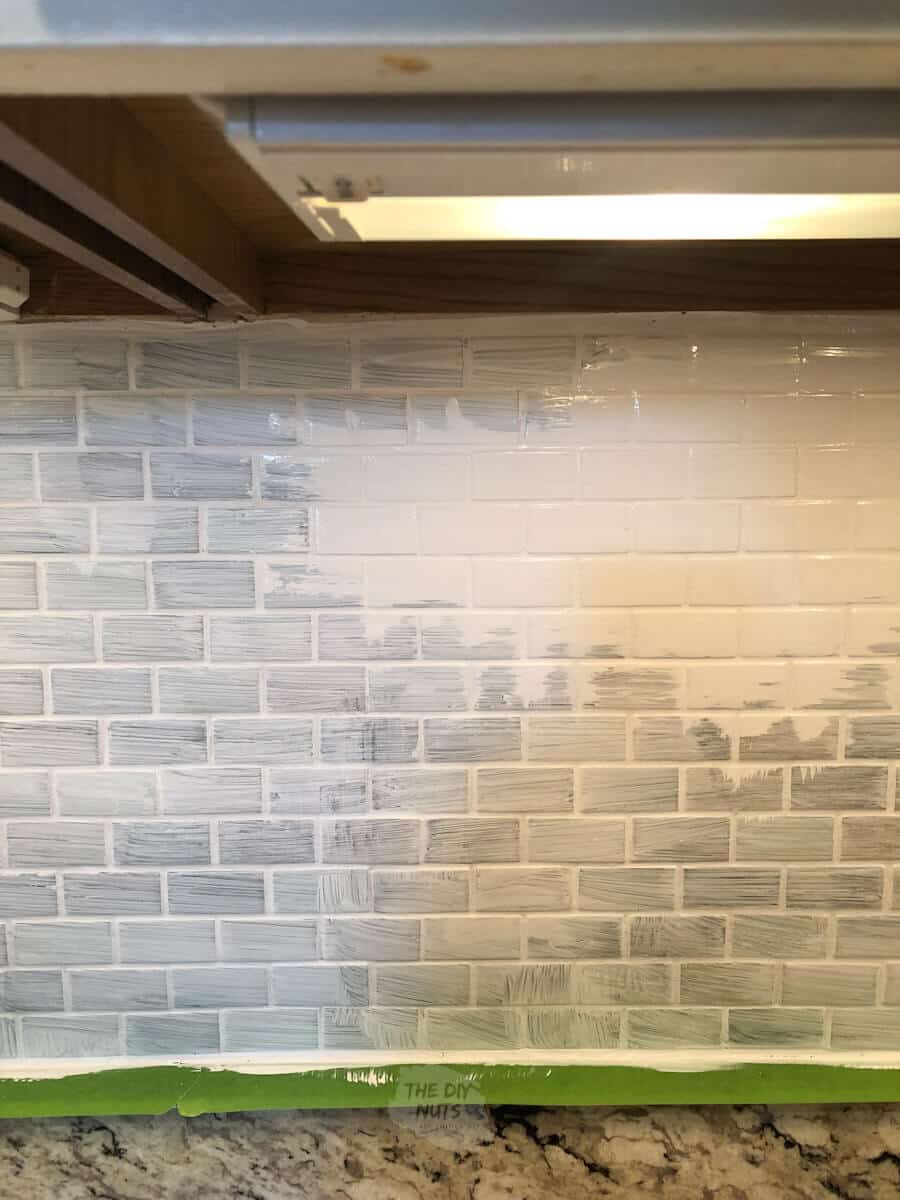white latex enamel painted on top of primer on backsplash tile