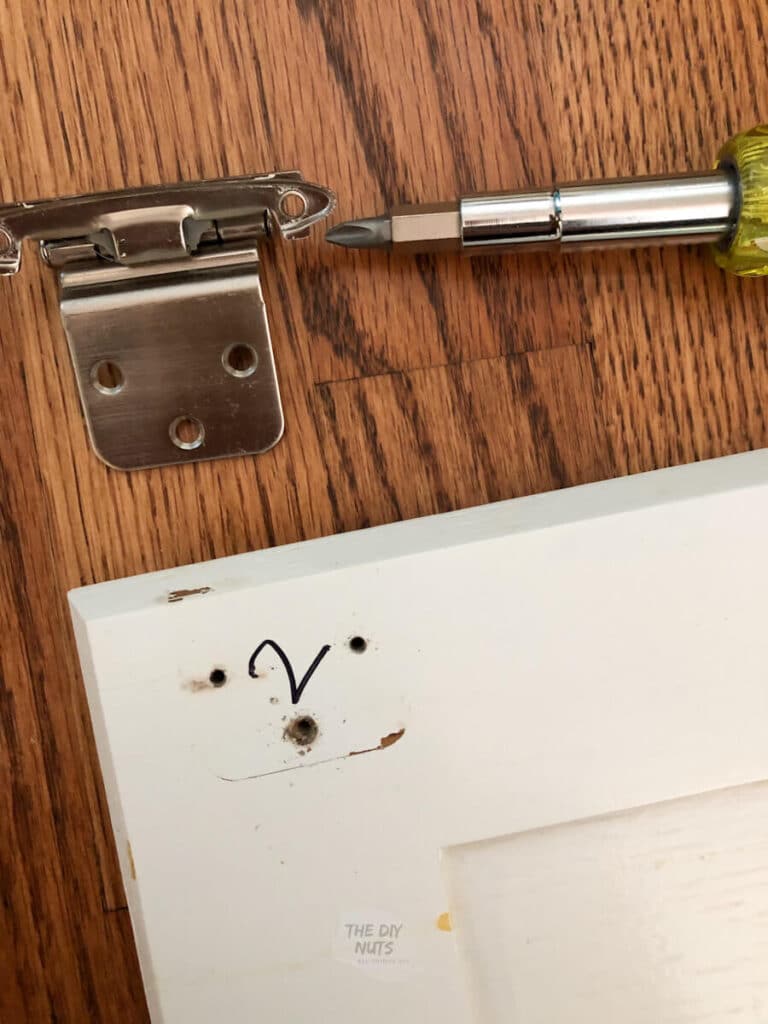 taking cabinet door hardware off