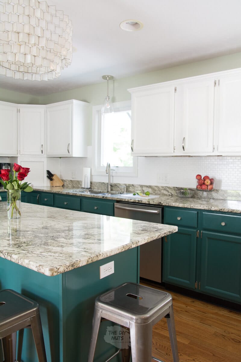 DIY kitchen remodel ideas with green painted lower cabinets and white upper cabinets and painted glass tilel backsplash.