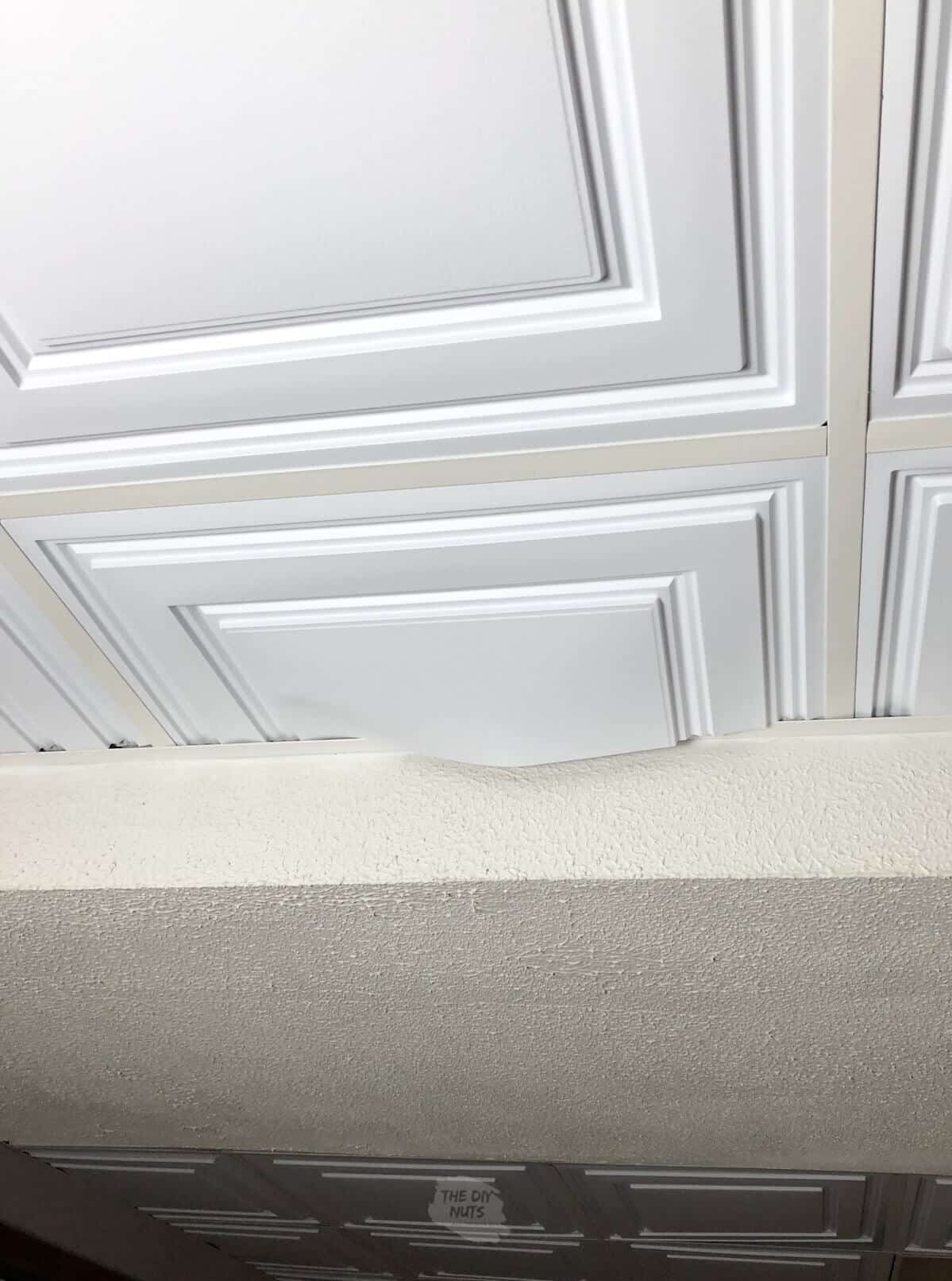 vinyl drop ceiling tile sagging after being cut wrong