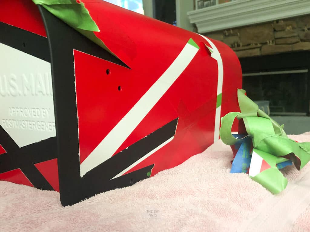 red,white and black spray painted mailbox design