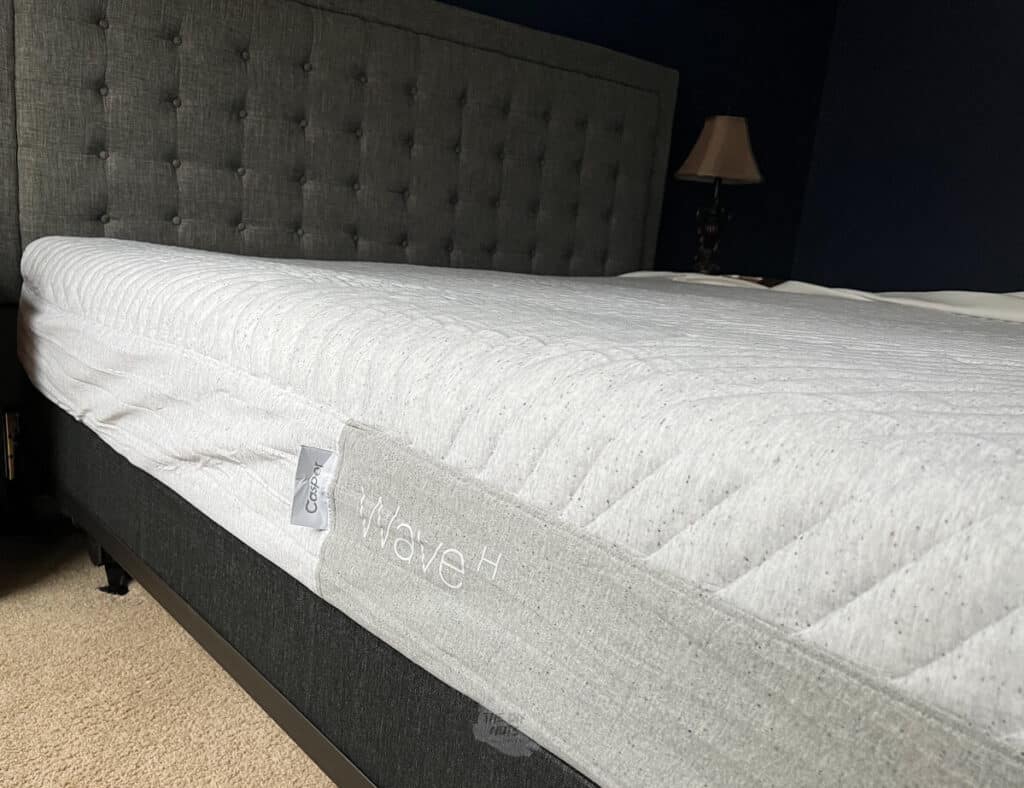 Casper Wave Hybrid mattress on Casper foundation with gray headboard