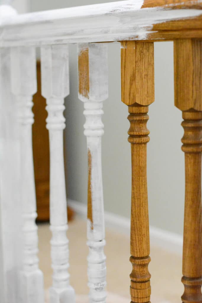 oak stair spindles being painted white.