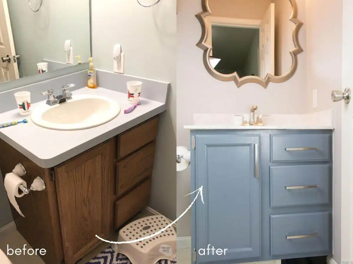 before oak bathroom vanity with arrow pointing to after painted blue gray bathroom cabinets with new mirror.