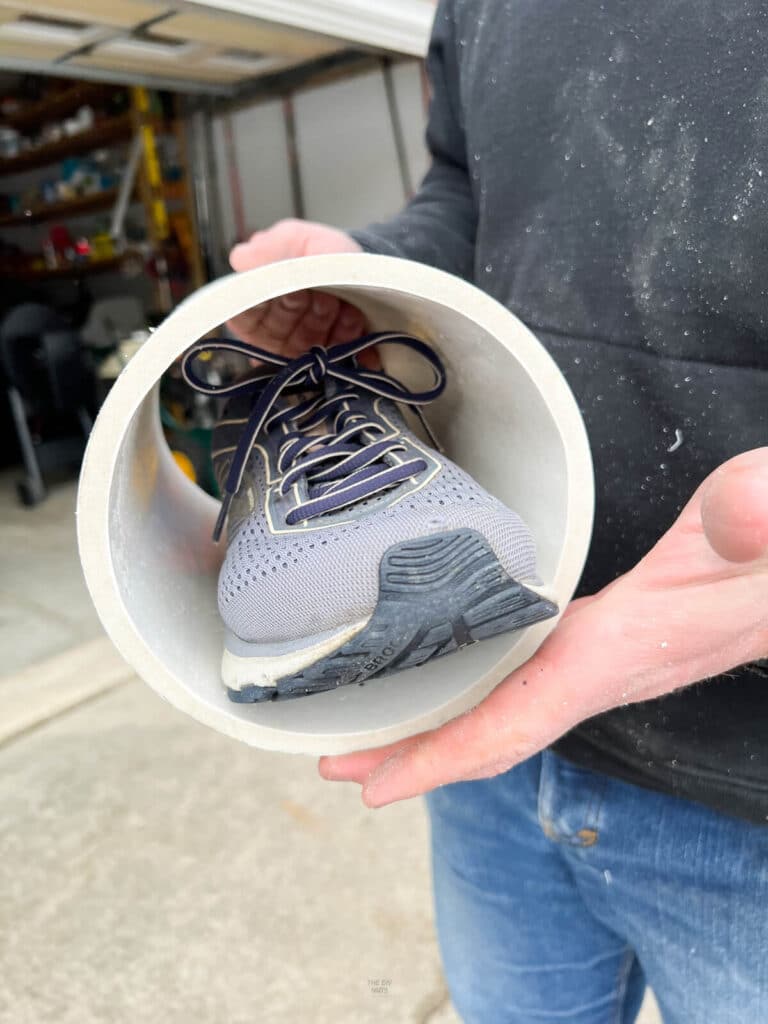 tennis shoe inside 6" PVC pipe to show how the shoe fits inside.