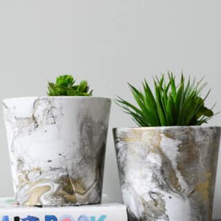 DIY marbled painted flower pots made with spray paint.