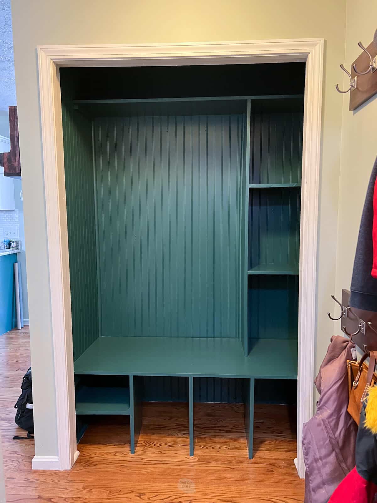 fully green painted closet cubby.