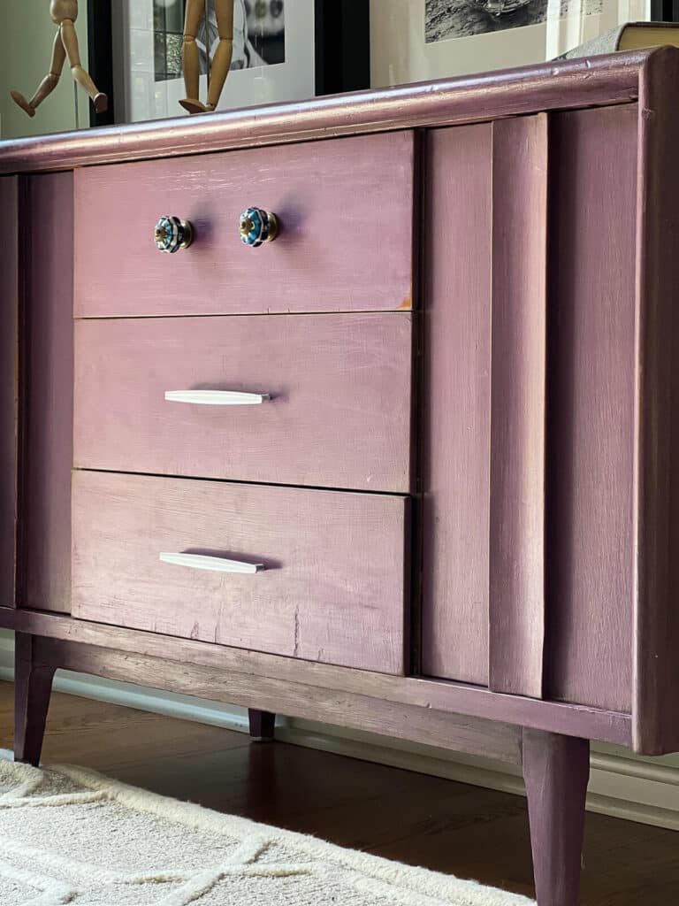 purple painted dresser with spray painted handles.