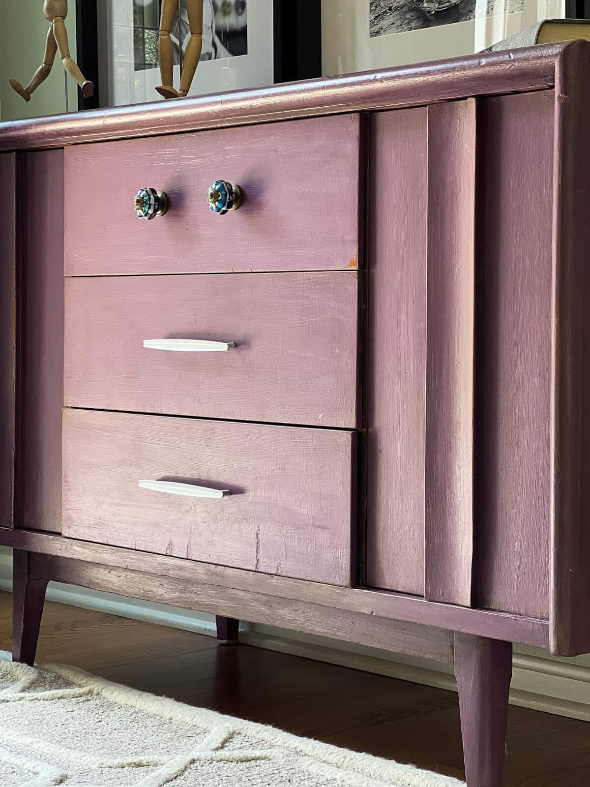 purple painted dresser with spray painted handles.