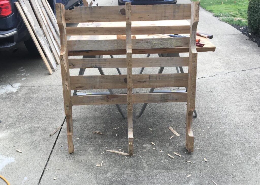 Inside of a wooden pallet with some wood off pallet.