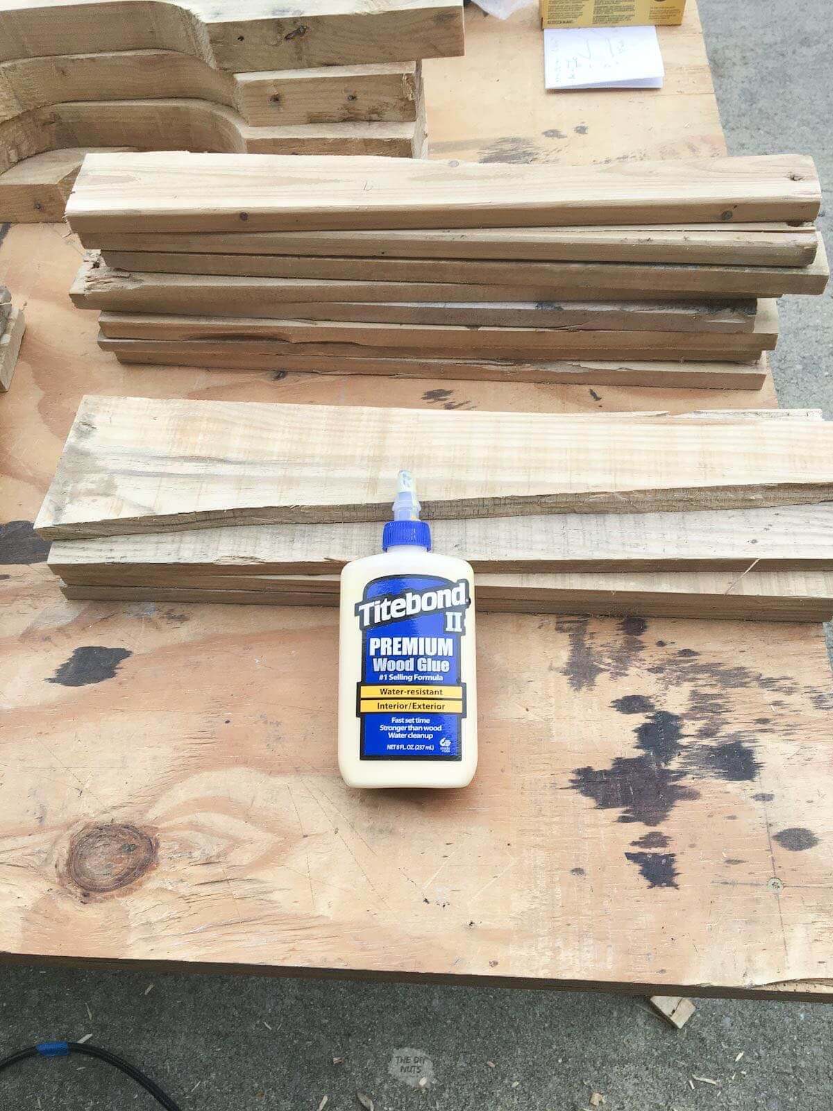 wood glue resting on sanding pallet wood.