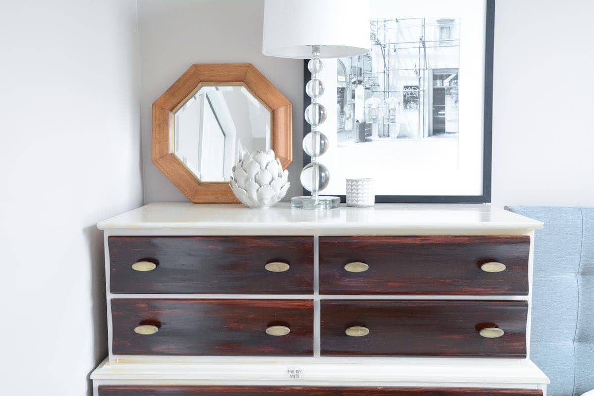 gel stained drawers and painted dresser with brass hardware.