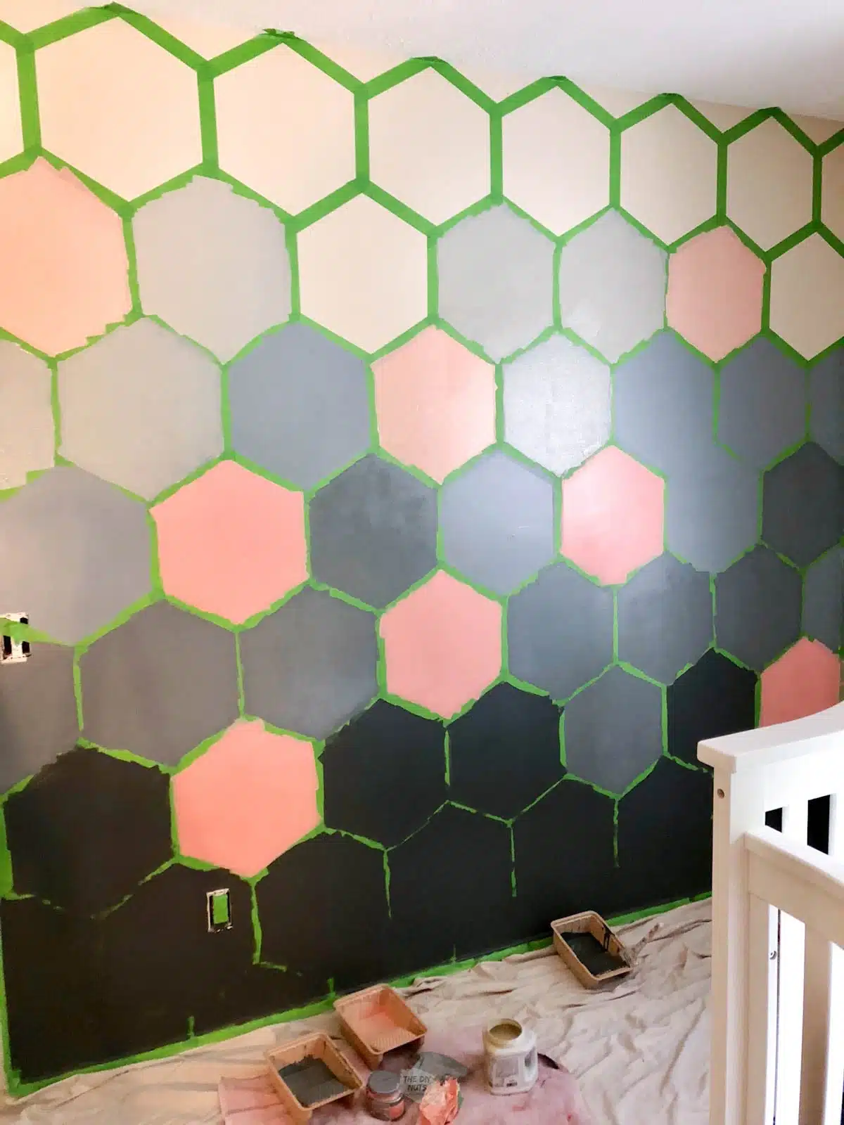 hexagon design on wall being partially painted.