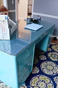 spray painted teal metal desk in office.