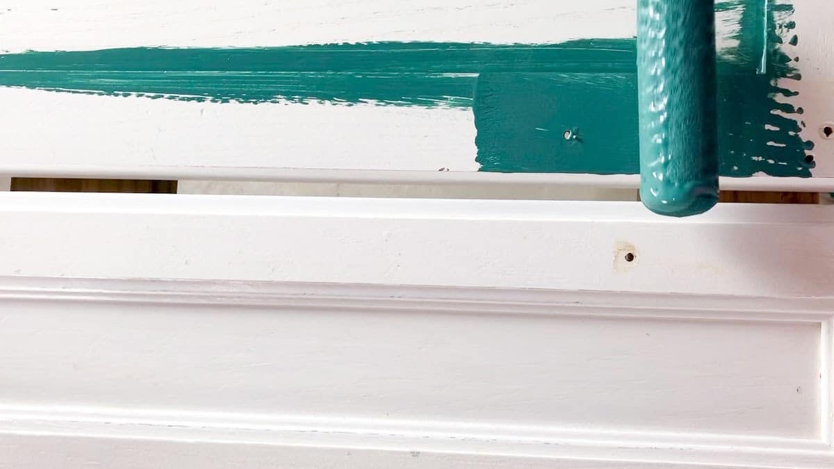 small foam roller painting cabinet door front green.