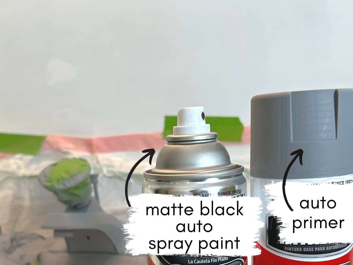 spray paint cans with text matte black auto spray paint and auto primer.