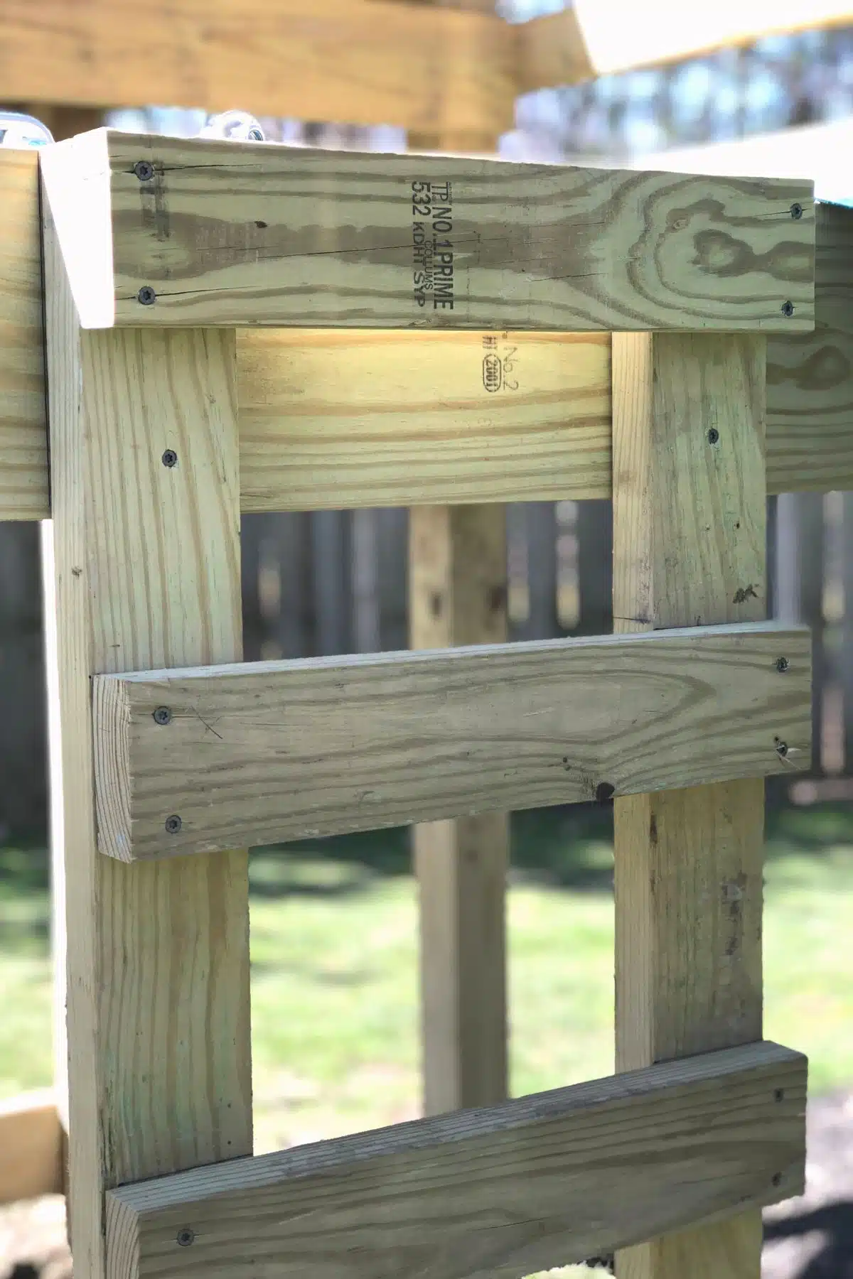 DIY wooden ladder on playground.