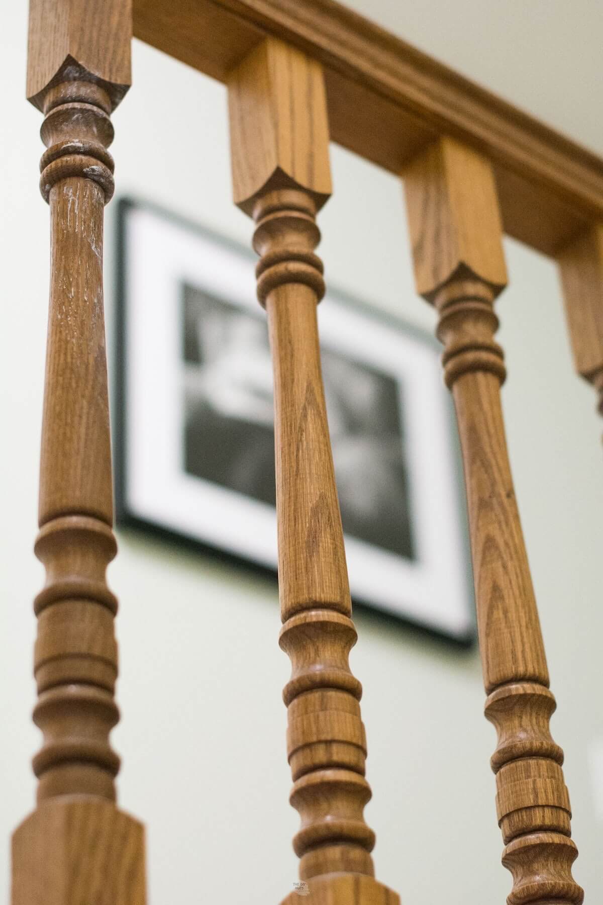 oak stair spindles on stairway banister and railing.
