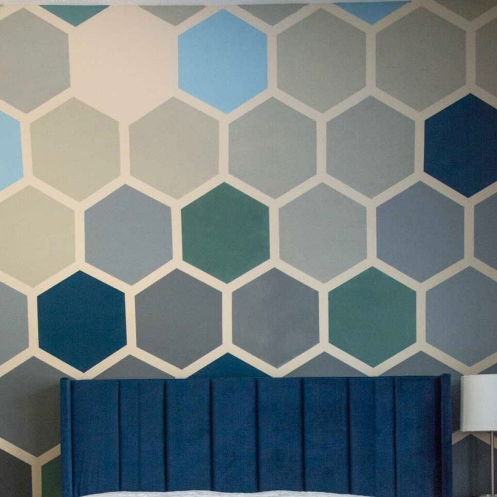 blue, gray hexagon wall with blue headboard.